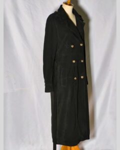 Damen Suede Trenchcoat black suede long coat shown from angled side view with gold double-breasted buttons